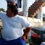 Holding his boat at dock single-handed - Zihuatanejo, Mexico - Ixtapa photo